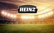 Il logo del sistema Heinz e sullo sfondo un campo da calcio